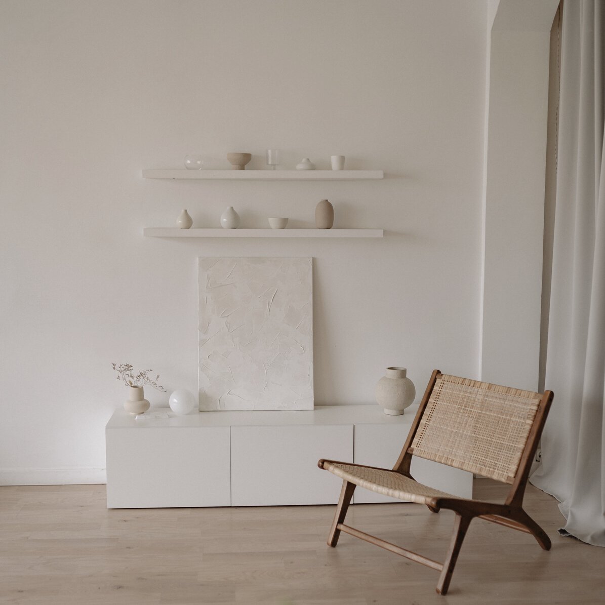 Brown Wooden Chair Beside White Wall